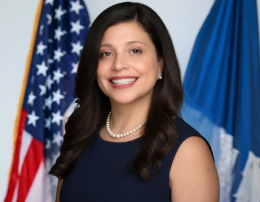 Patrice Bell Portrait of Patrice Bell, Chief Administrative Officer, smiling in a navy dress and wearing a pearl necklace.